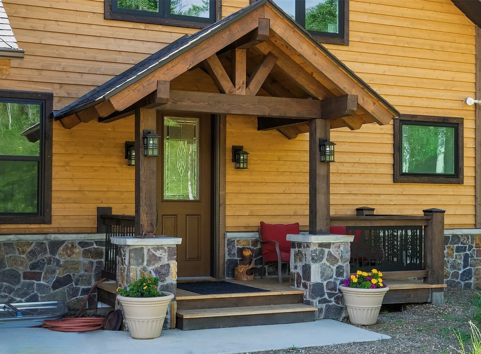 Mountain home exterior with snow-capped peaks